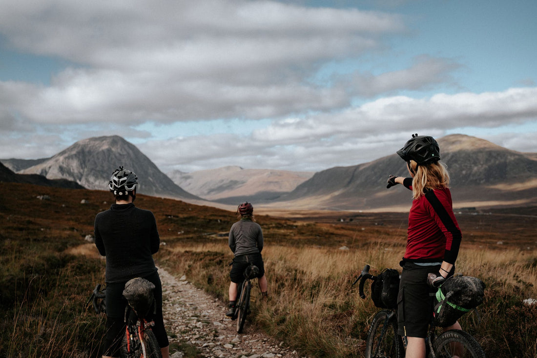 Group of people riding bikes in the Scottish highlands