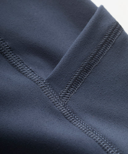 Close-up of a dark blue leggings with flatlock seam detail