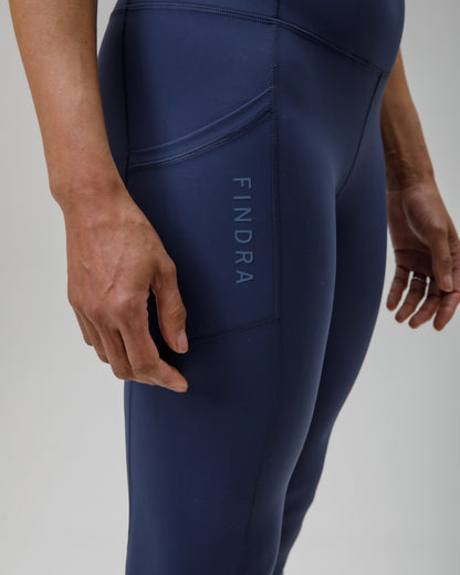 Navy blue leggings with 'FINDRA' branding on a light gray background