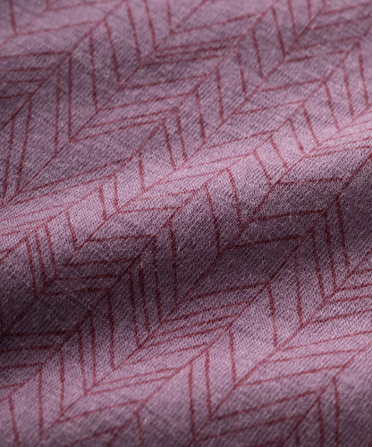 Close-up of purple merino fabric with a subtle geometric pattern