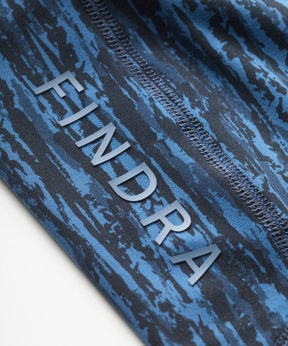 Printed 'FINDRA' logo on a textured blue and black legging showing flatlocked seams
