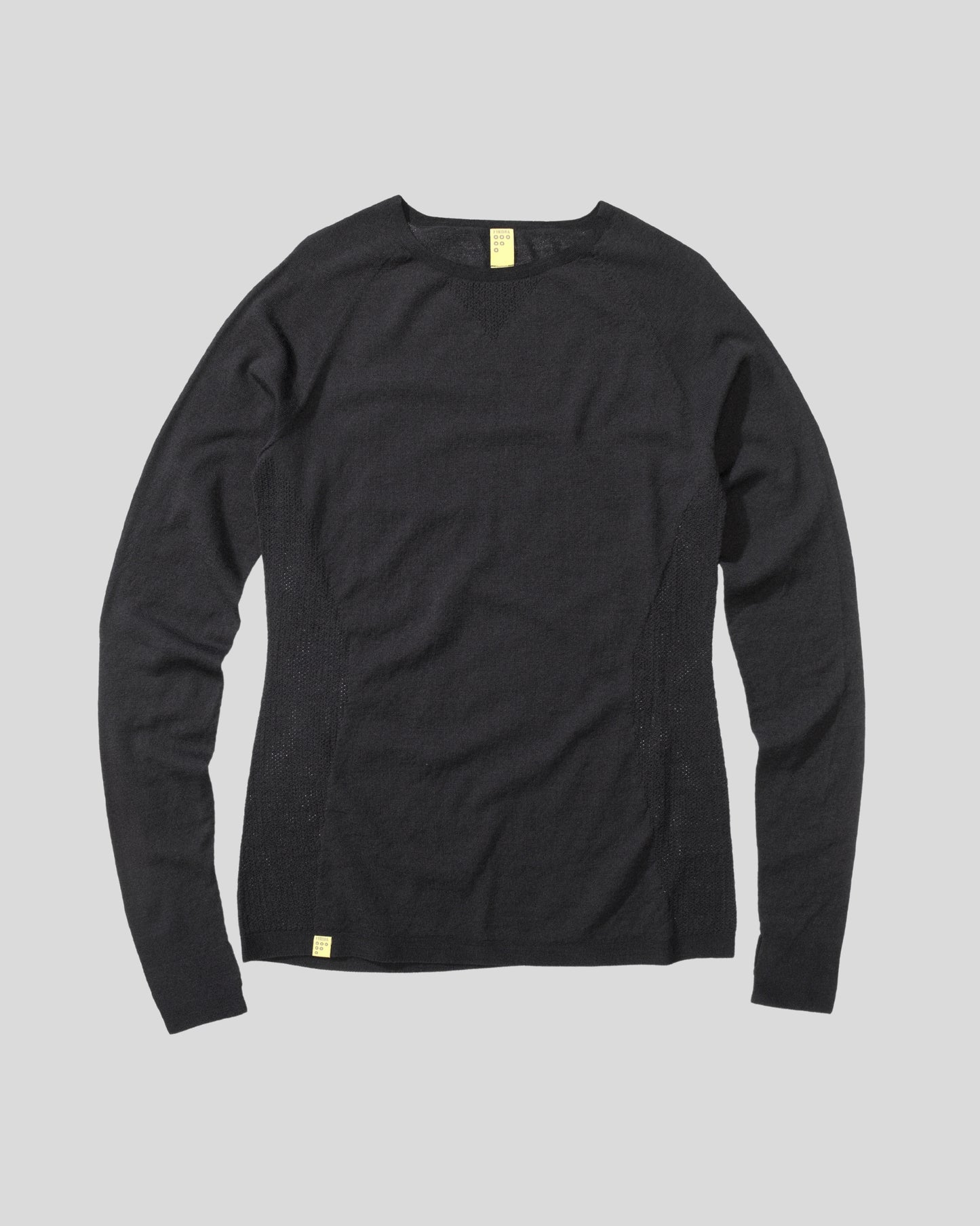 Black long-sleeve shirt on a gray background