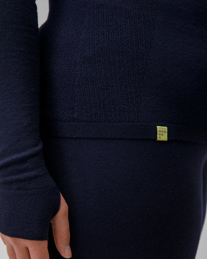 Navy blue garment with a small FINDRA yellow label on a light gray background