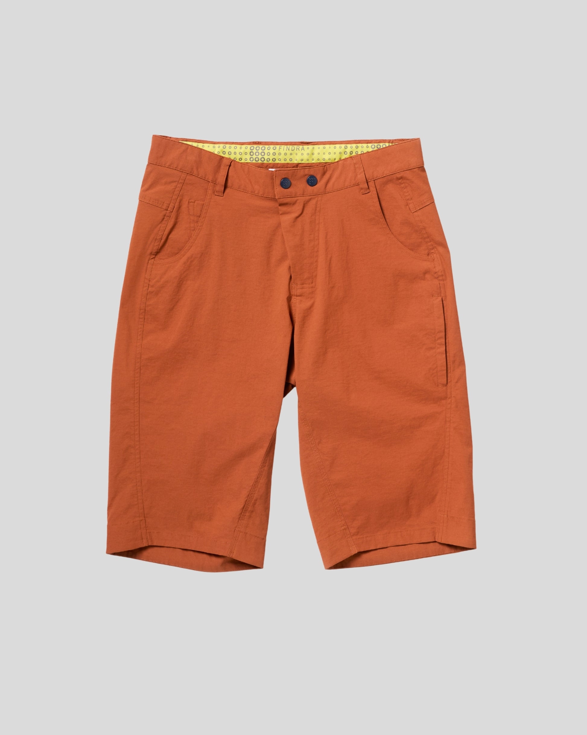 Orange shorts on a light gray background