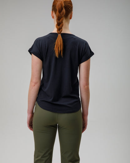 woman wearing a charcoal merino wool t-shirt on a grey background