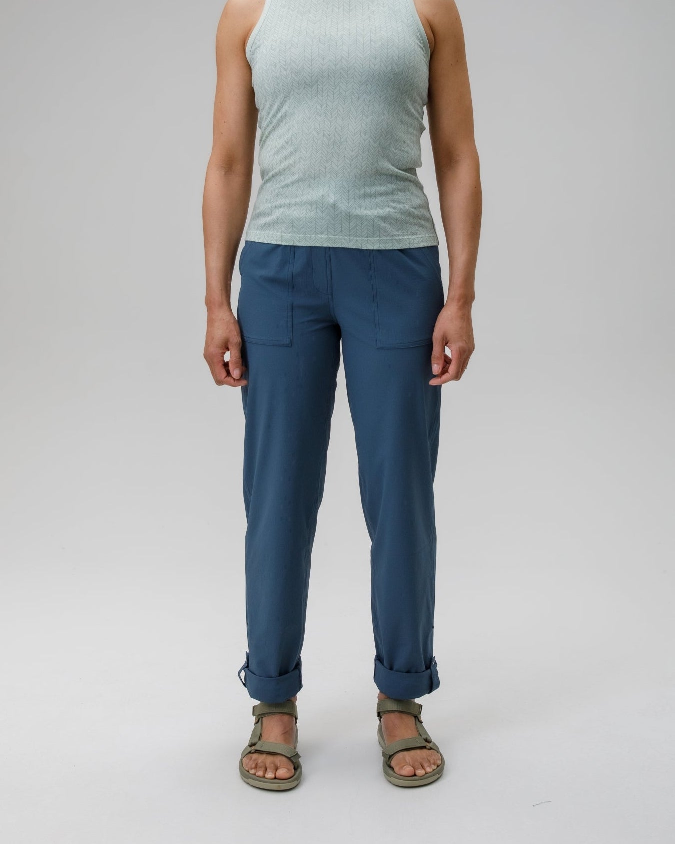 woman wearing steel blue FINRDA walking trousers on a white background