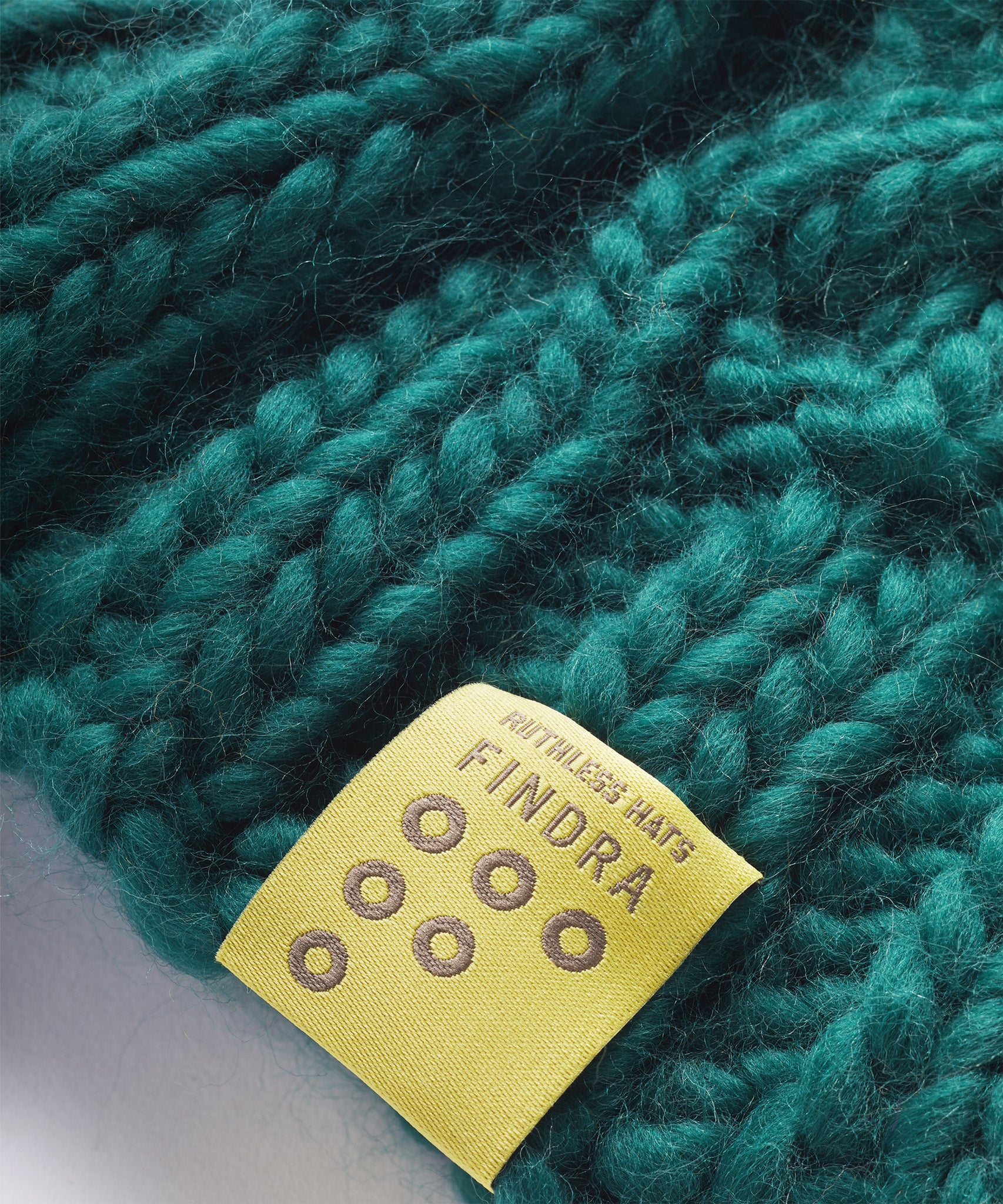 FINDRA Cable Knit Merino Bobble Hat Mallard - Label